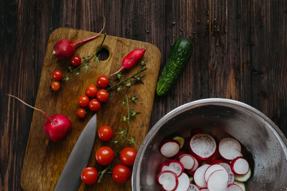 Fresh vegetables and a kitchen knife arranged for simple everyday cooking.